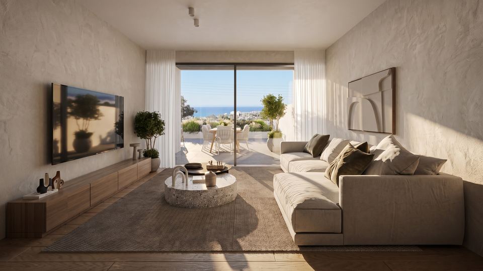 Living room opening to a terrace with a sea view
