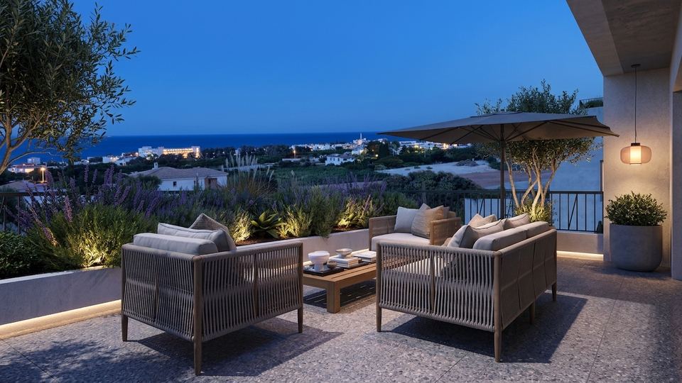 Terrace seating at dusk overlooking the coast