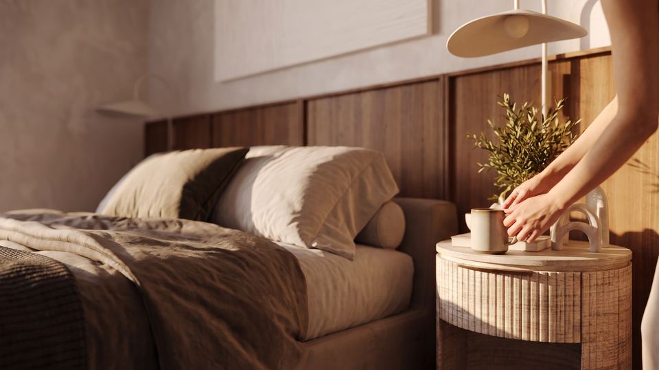 Bedside detail as a resident sets down a cup