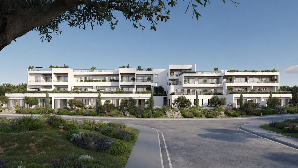 Street-level view of the development with residents in the gardens
